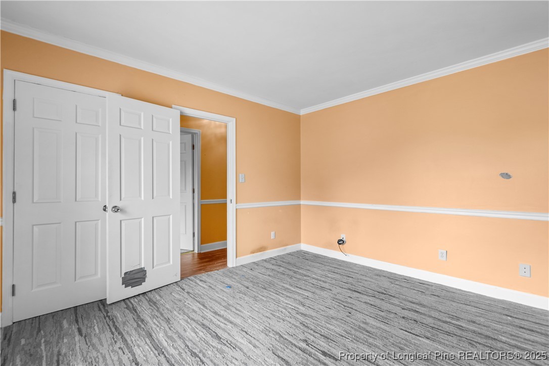 124 Racquet Lane Pinehurst, NC 28374 - Photo 16 of 25 a view of a room with wooden floor