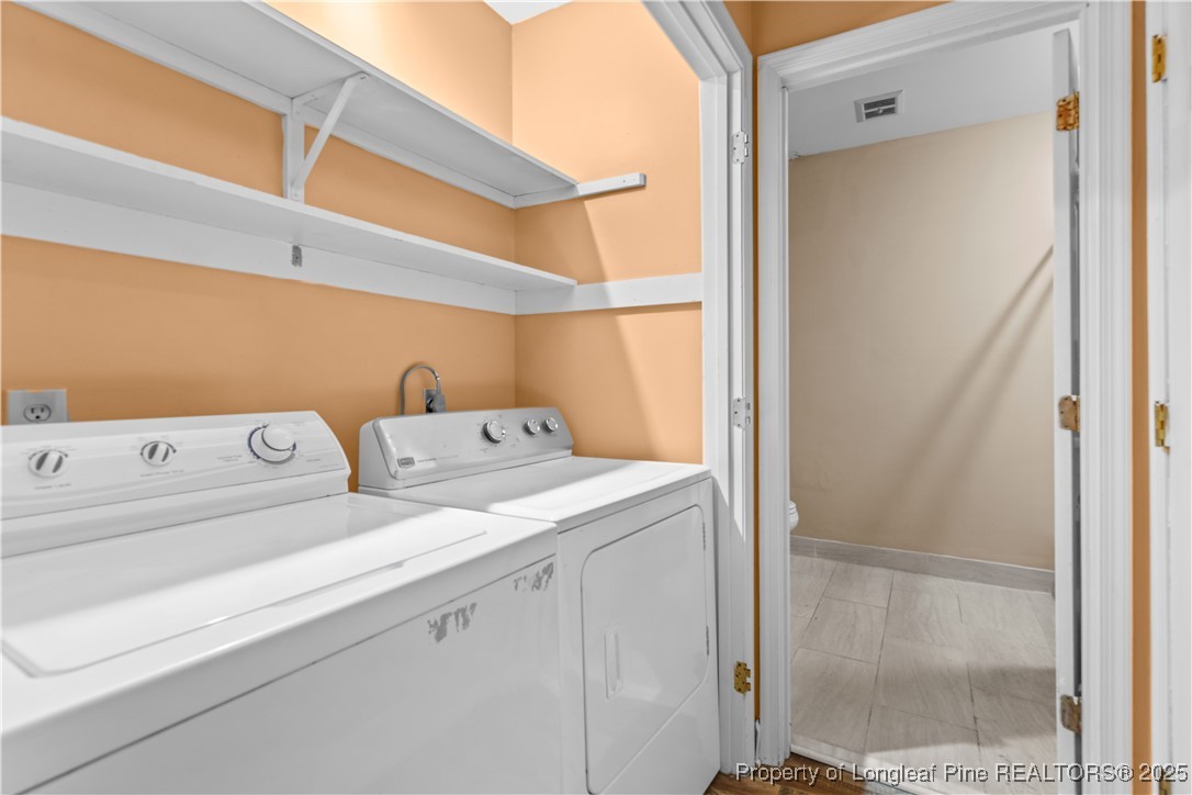124 Racquet Lane Pinehurst, NC 28374 - Photo 21 of 25 a utility room with dryer and washer