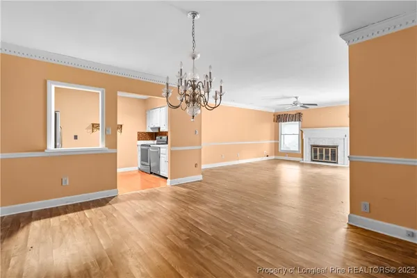 a view of a kitchen with microwave and refrigerator