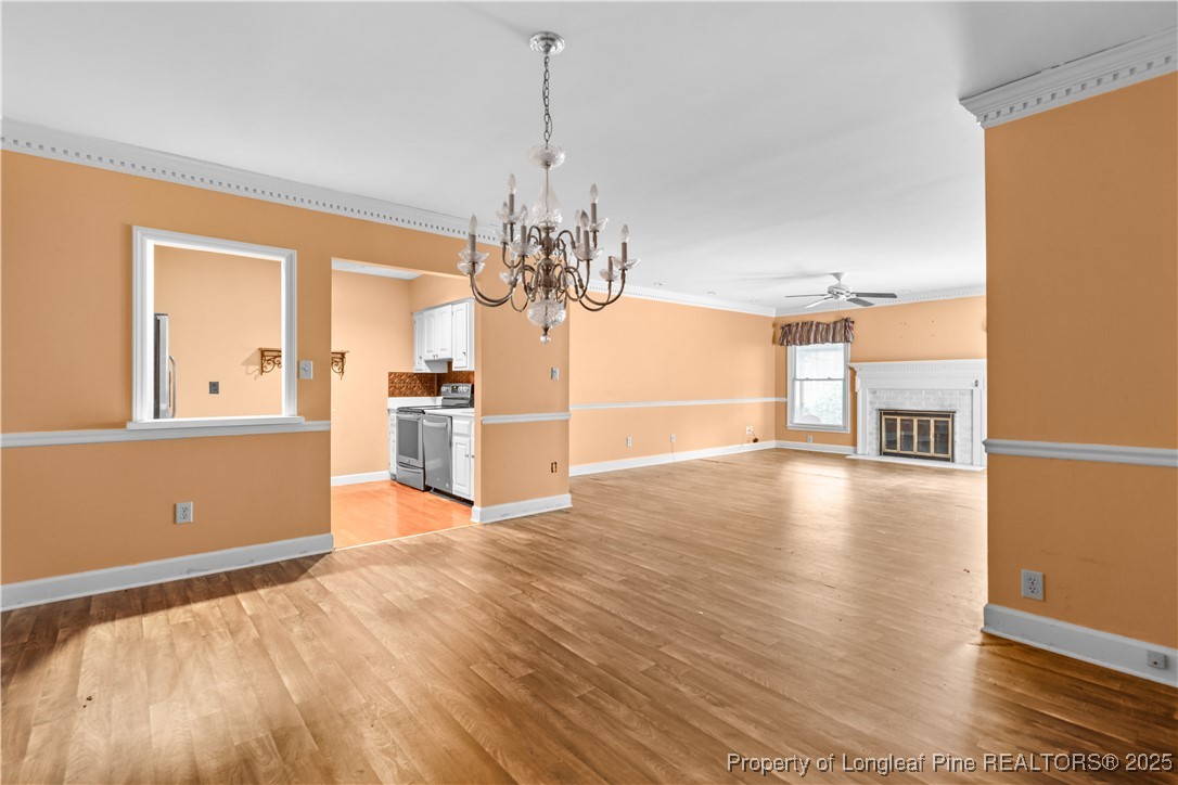 124 Racquet Lane Pinehurst, NC 28374 - Photo 6 of 25 a view of a kitchen with microwave and refrigerator