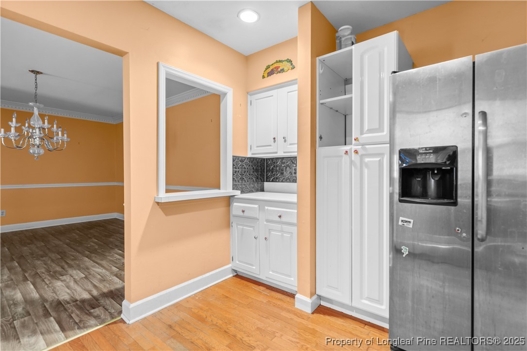 124 Racquet Lane Pinehurst, NC 28374 - Photo 7 of 25 a view of kitchen space with cabinets