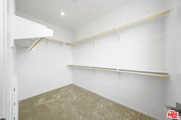a view of an empty walk in closet