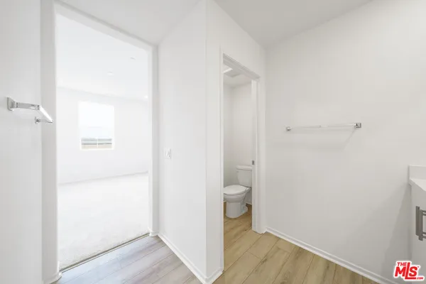 a view of a bathroom from a hallway