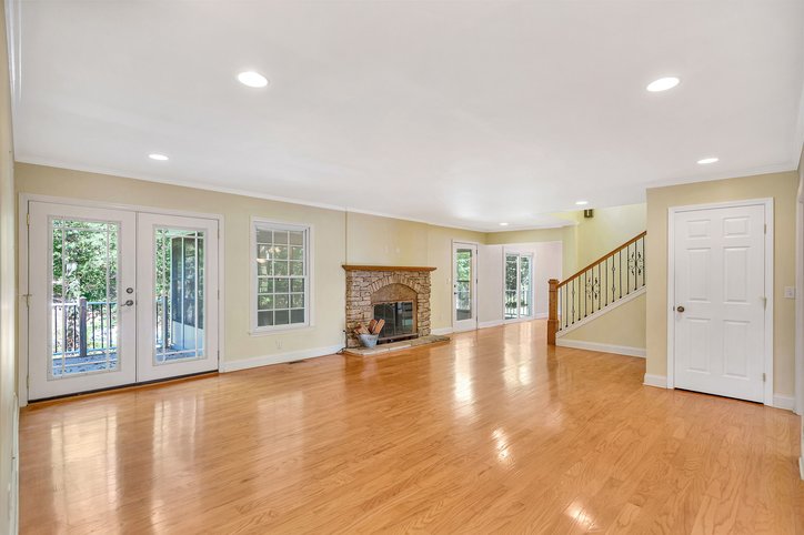 106 Pikes Ridge Anderson, SC 29626 - Photo 12 of 41 Gleaming hardwood floors and a classic stone fireplace anchor this open and airy living space.