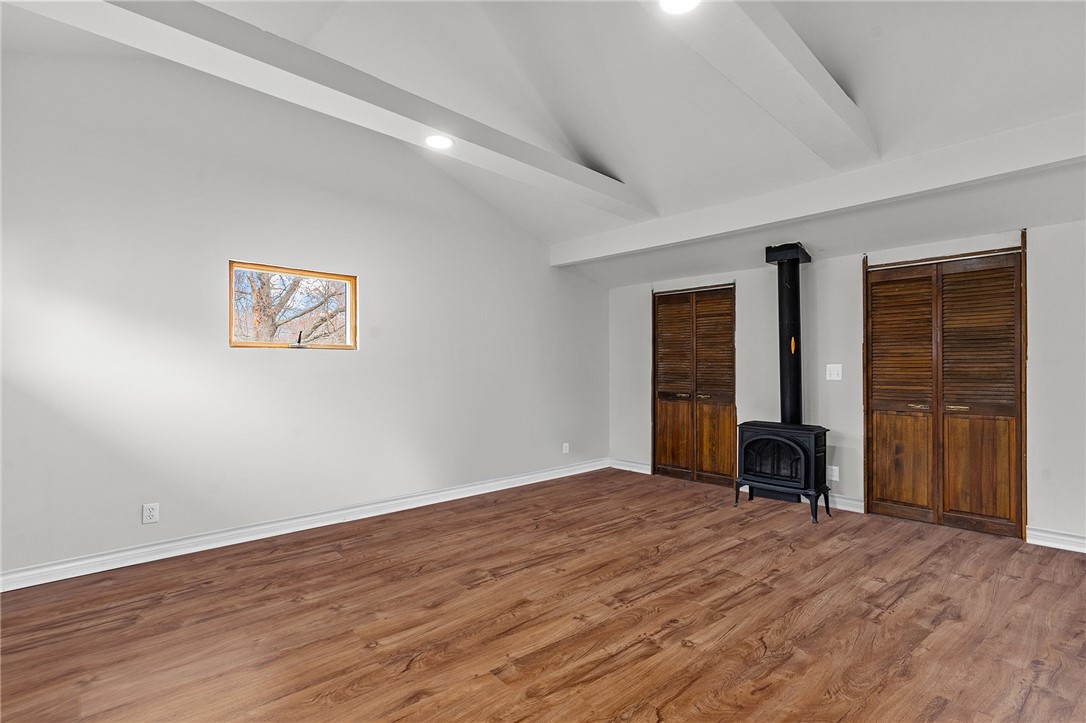 208 Baldwin Road Warwick, RI 02886 - Photo 12 of 35 Bonus Room with double closet (whole length) and gas stove - please note (4/3) the flooring has been complete with Photoshop but it will be finished by Open House 4/4.