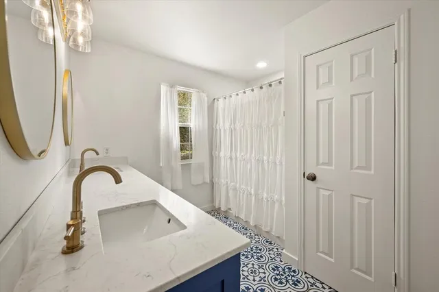 a kitchen with a sink and cabinets