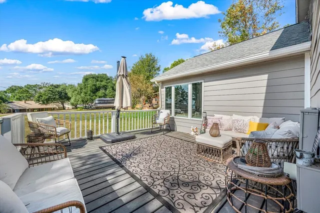 an aerial view of a house with a yard and lake view