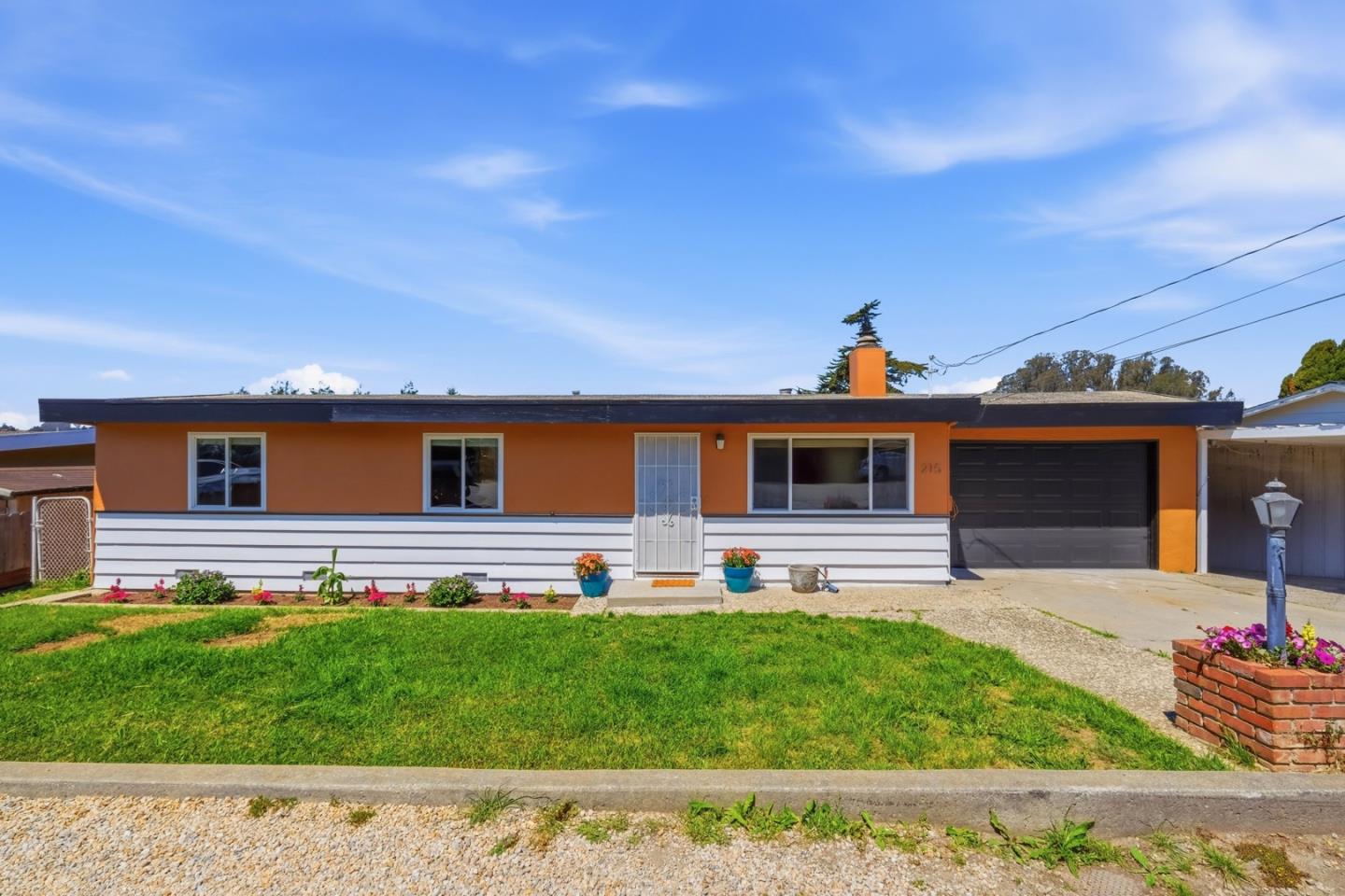 215 Manfre Road Watsonville, CA 95076 - Photo 2 of 36 a front view of a house with a yard