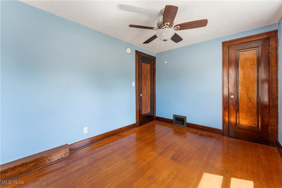 1623 Spangler Road Northeast Canton, OH 44714 - Photo 25 of 28 Spare room with hardwood / wood-style floors and ceiling fan