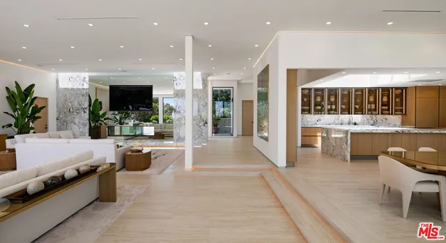 a lobby with furniture and a potted plant