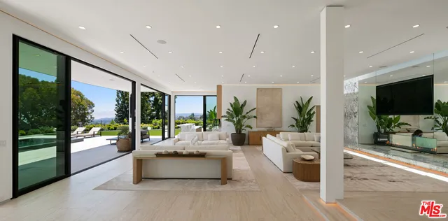 a large kitchen with granite countertop a sink and a large window