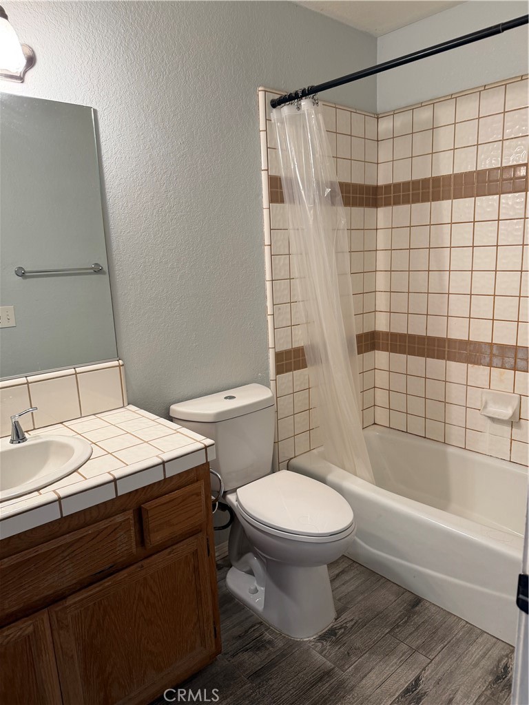 18602 Cocqui Road Apple Valley, CA 92307 - Photo 9 of 16 a bathroom with a sink toilet and shower