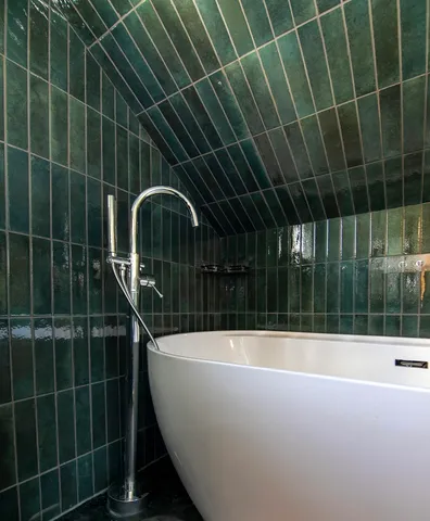 a view of a bathtub in a bathroom