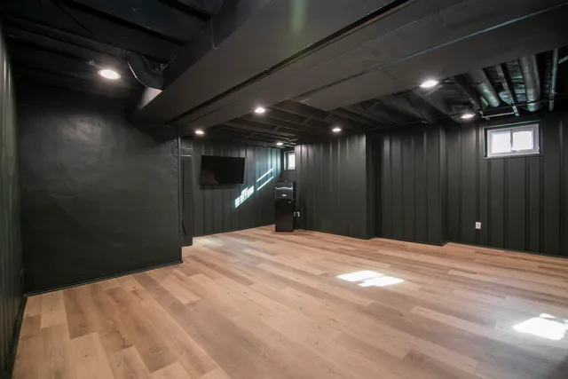 a bed room with a bed and a night stand