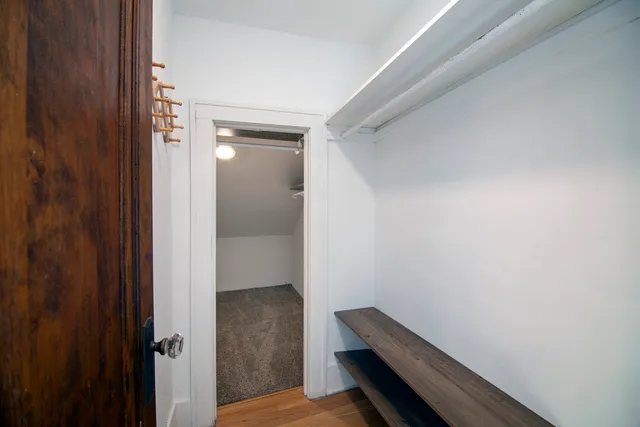 a view of room with wooden floor