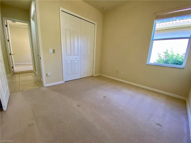 a view of an empty room with a sliding door