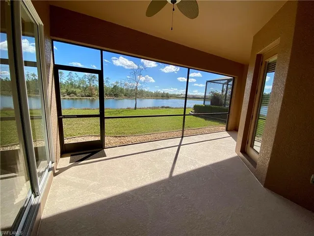 a view of a lake with houses in the background