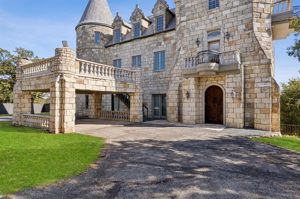 9888 Boat Club Road Fort Worth, TX 76179 - Photo 14 of 38 a front view of a house with a garden