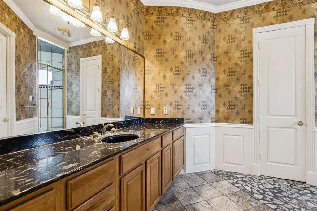 9888 Boat Club Road Fort Worth, TX 76179 - Photo 33 of 38 a bathroom with a granite countertop sink and a mirror