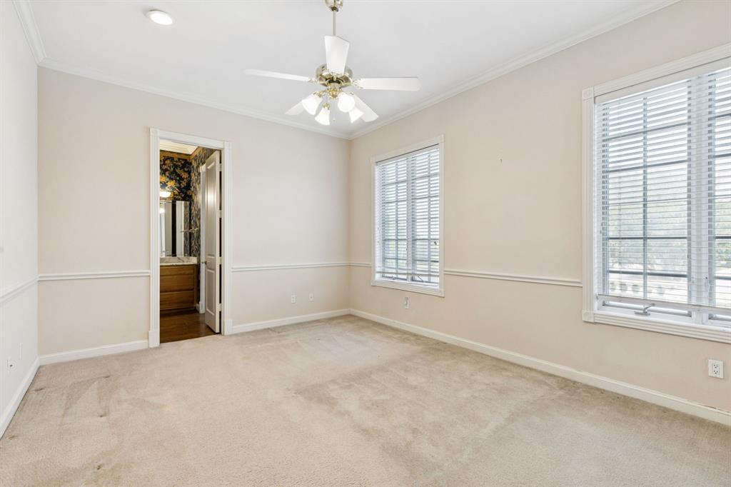 9888 Boat Club Road Fort Worth, TX 76179 - Photo 34 of 38 an empty room with windows and chandelier