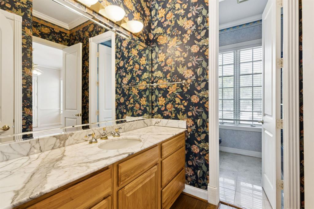 9888 Boat Club Road Fort Worth, TX 76179 - Photo 35 of 38 a bathroom with a sink and a mirror