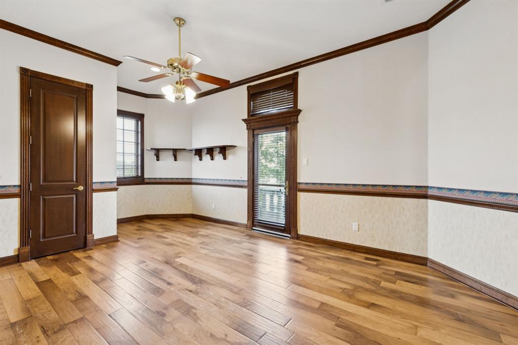 9888 Boat Club Road Fort Worth, TX 76179 - Photo 36 of 38 a view of a kitchen with wooden floor electronic appliances and a ceiling fan