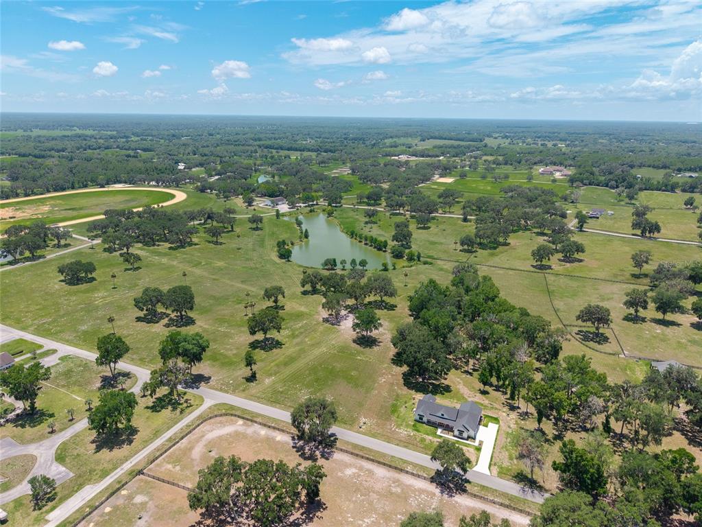 Southeast 61st Terrace Road, Unit 15 Summerfield, FL 34491 - Photo 13 of 18 an aerial view of residential houses with outdoor space