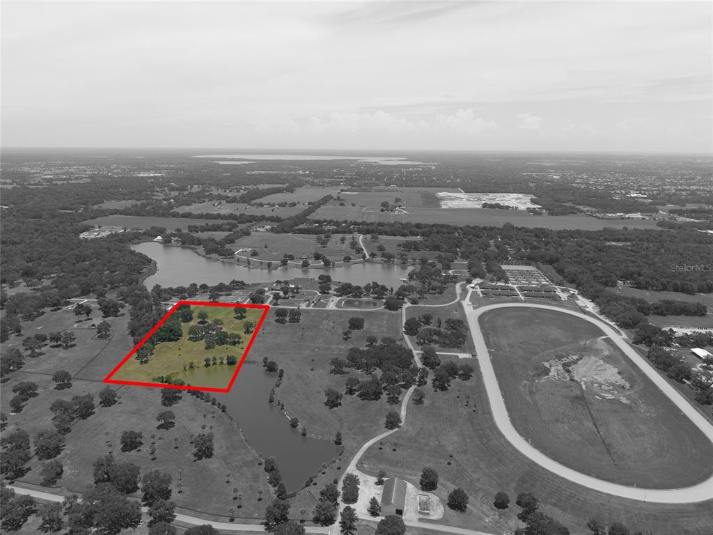 Southeast 61st Terrace Road, Unit 15 Summerfield, FL 34491 - Photo 8 of 18 an aerial view of a house with a yard