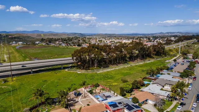 a view of a lake with houses in the background