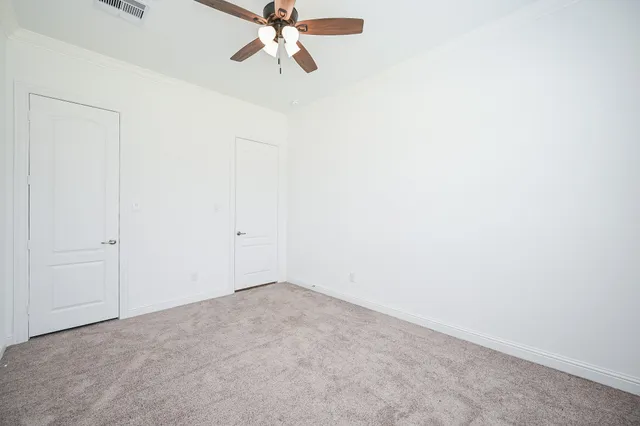 a view of a room with a fan