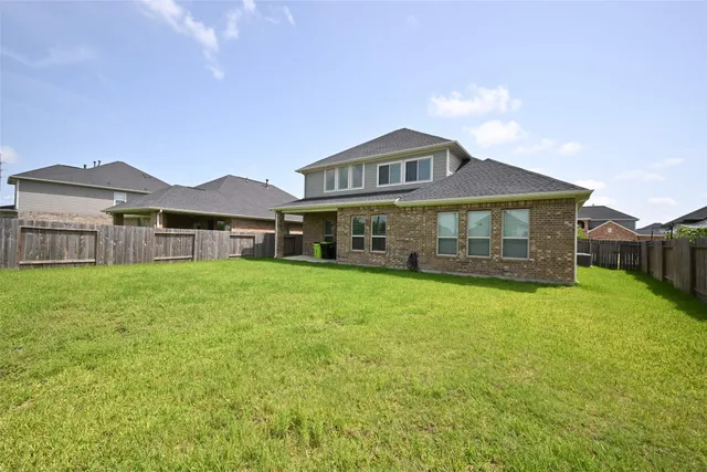 a front view of a house with a yard and porch