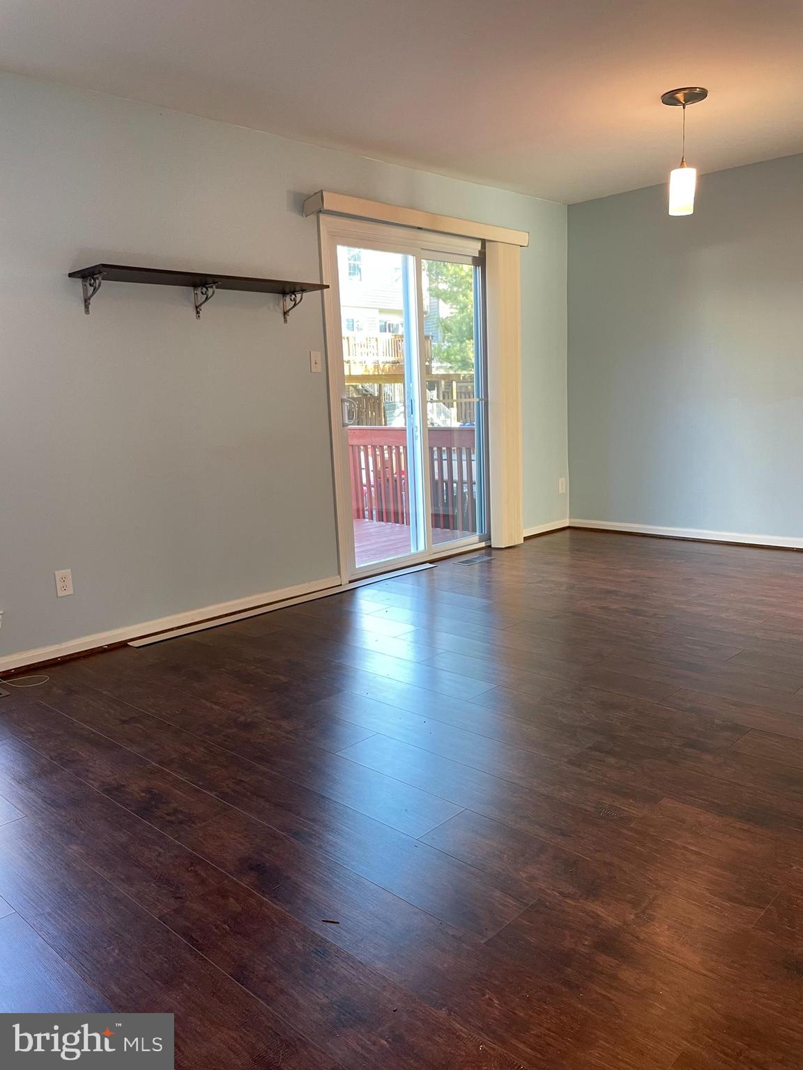 12405 Gooderham Way Gaithersburg, MD 20878 - Photo 11 of 31 an empty room with wooden floor and windows