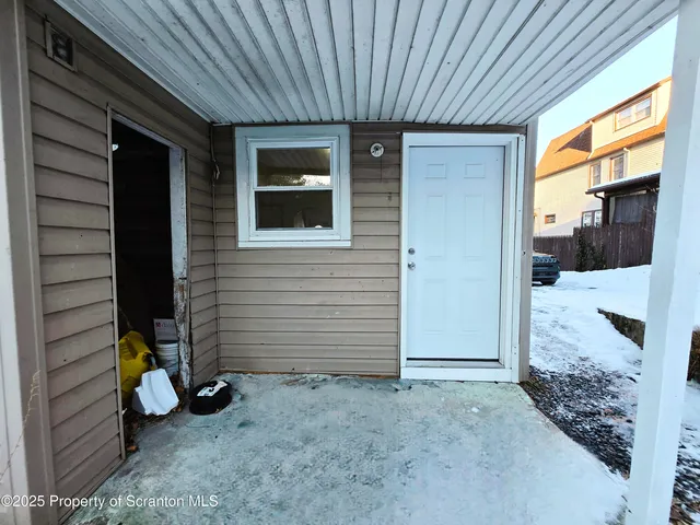 a view of a porch with hardwood
