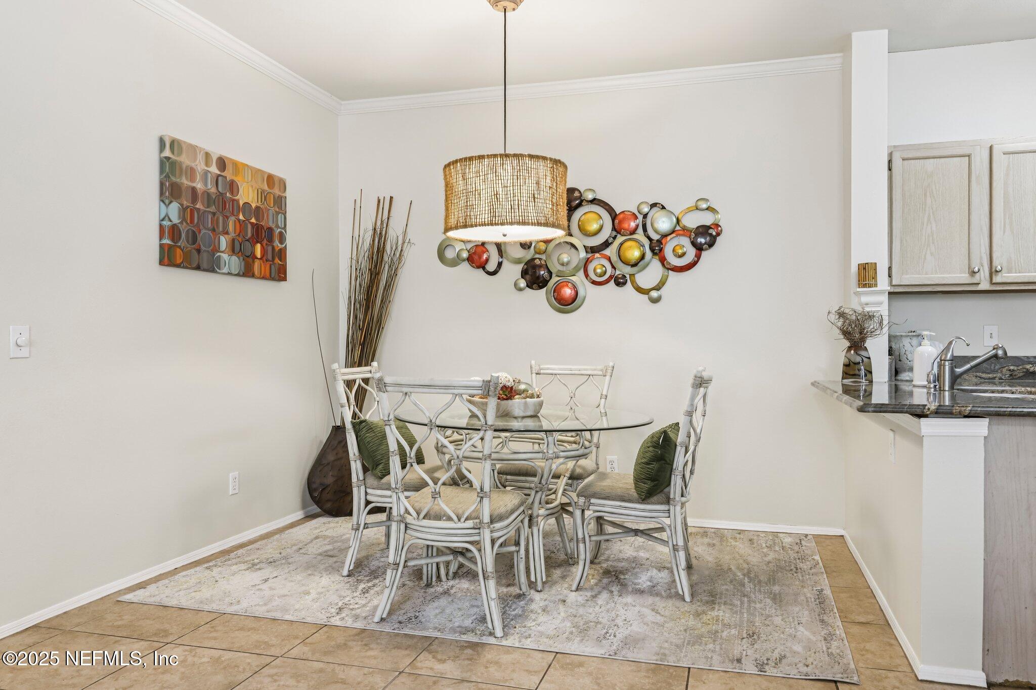 201 Colima Court, Unit 1221 Ponte Vedra Beach, FL 32082 - Photo 11 of 50 a view of a dining room with furniture