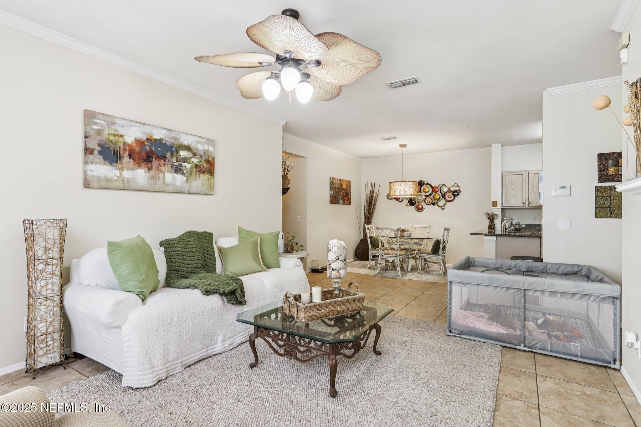 201 Colima Court, Unit 1221 Ponte Vedra Beach, FL 32082 - Photo 12 of 50 a living room with furniture and white walls