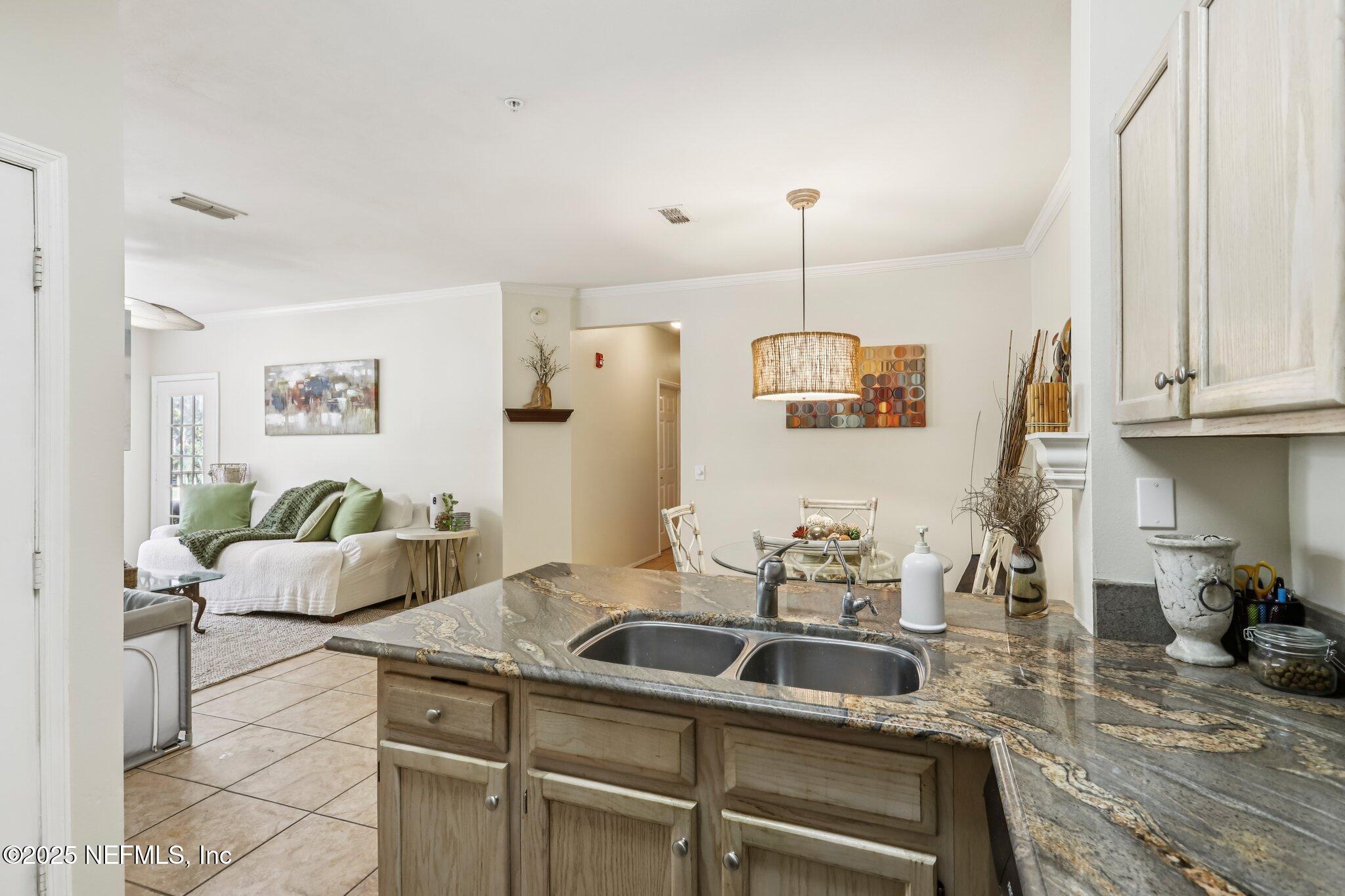 201 Colima Court, Unit 1221 Ponte Vedra Beach, FL 32082 - Photo 20 of 50 a bathroom with a sink and a refrigerator