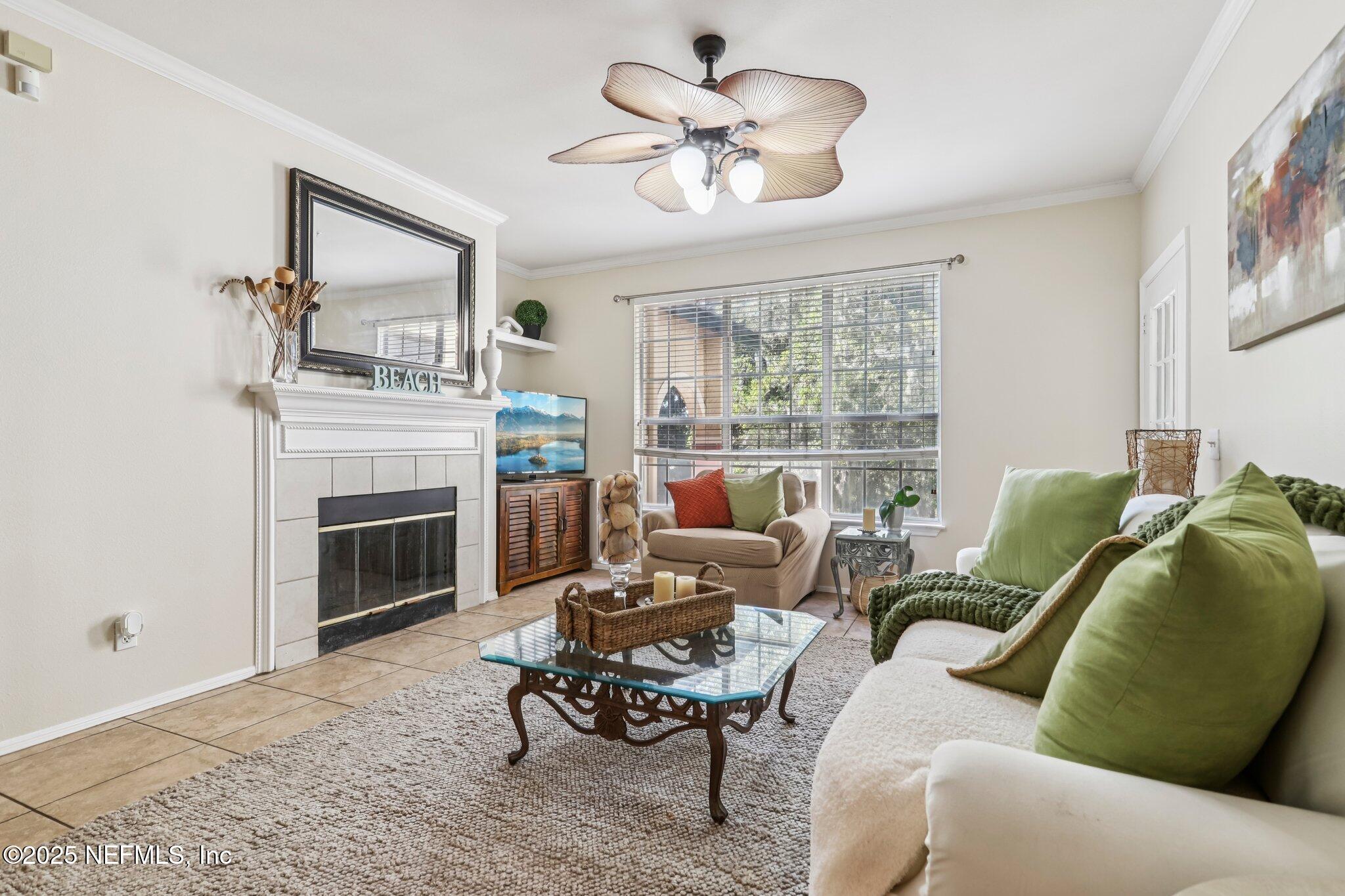 201 Colima Court, Unit 1221 Ponte Vedra Beach, FL 32082 - Photo 2 of 50 a living room with furniture and a fireplace