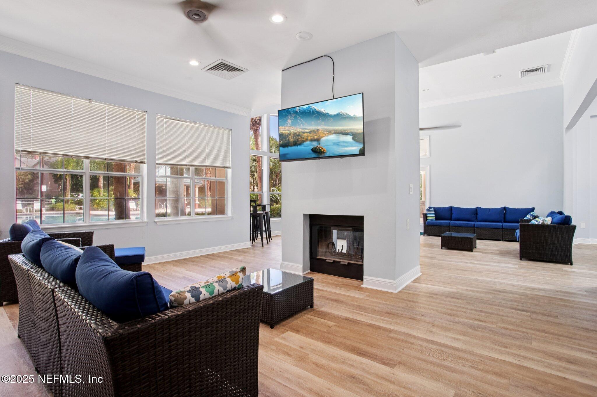 201 Colima Court, Unit 1221 Ponte Vedra Beach, FL 32082 - Photo 38 of 50 a living room with furniture fireplace and flat screen tv