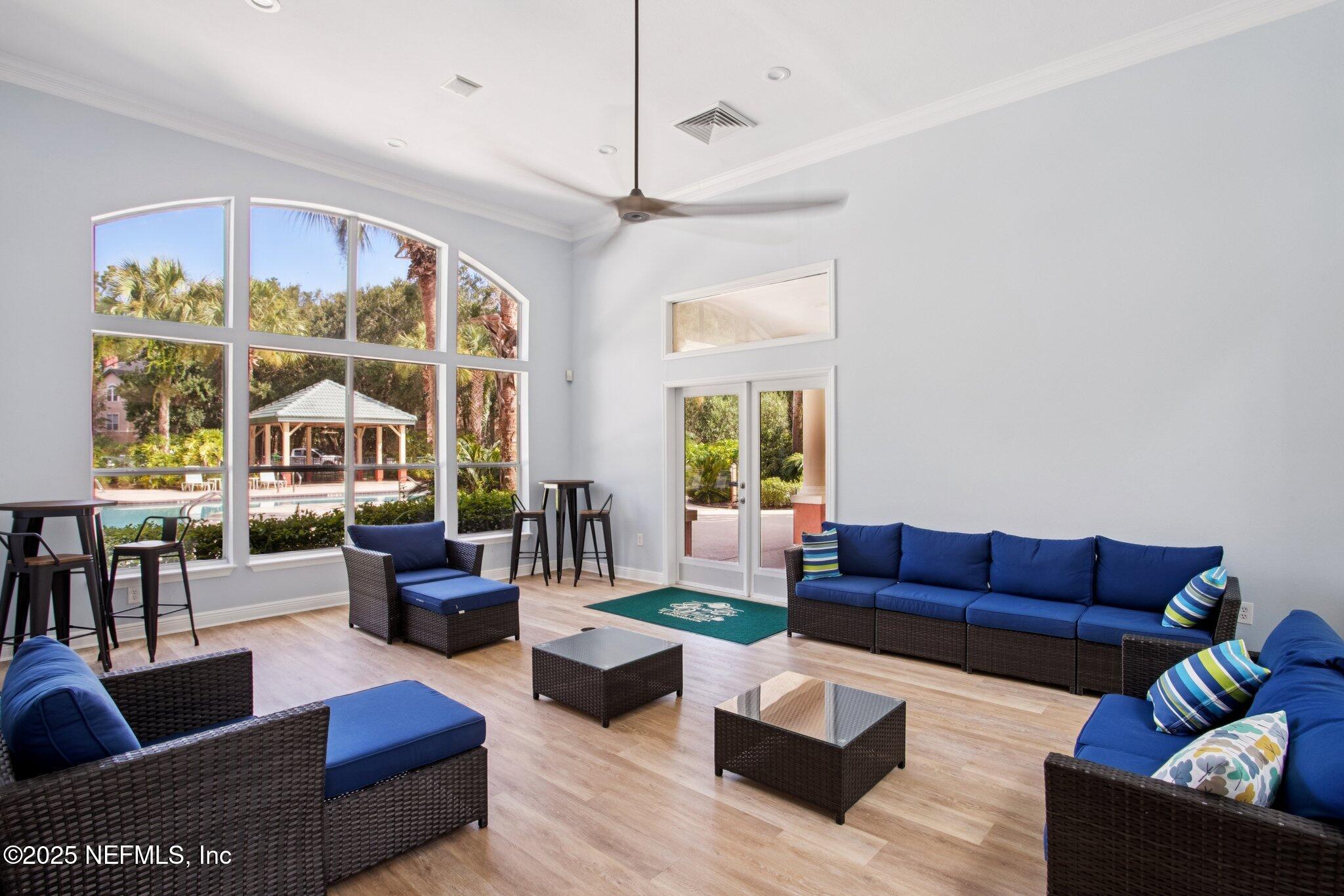 201 Colima Court, Unit 1221 Ponte Vedra Beach, FL 32082 - Photo 40 of 50 a living room with furniture and a large window
