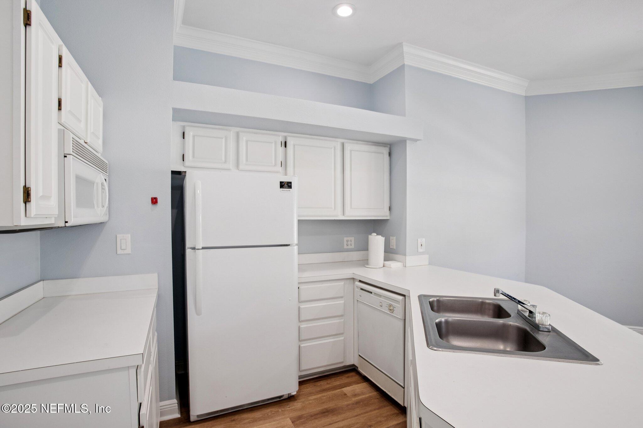 201 Colima Court, Unit 1221 Ponte Vedra Beach, FL 32082 - Photo 42 of 50 a white refrigerator freezer sitting inside of a kitchen
