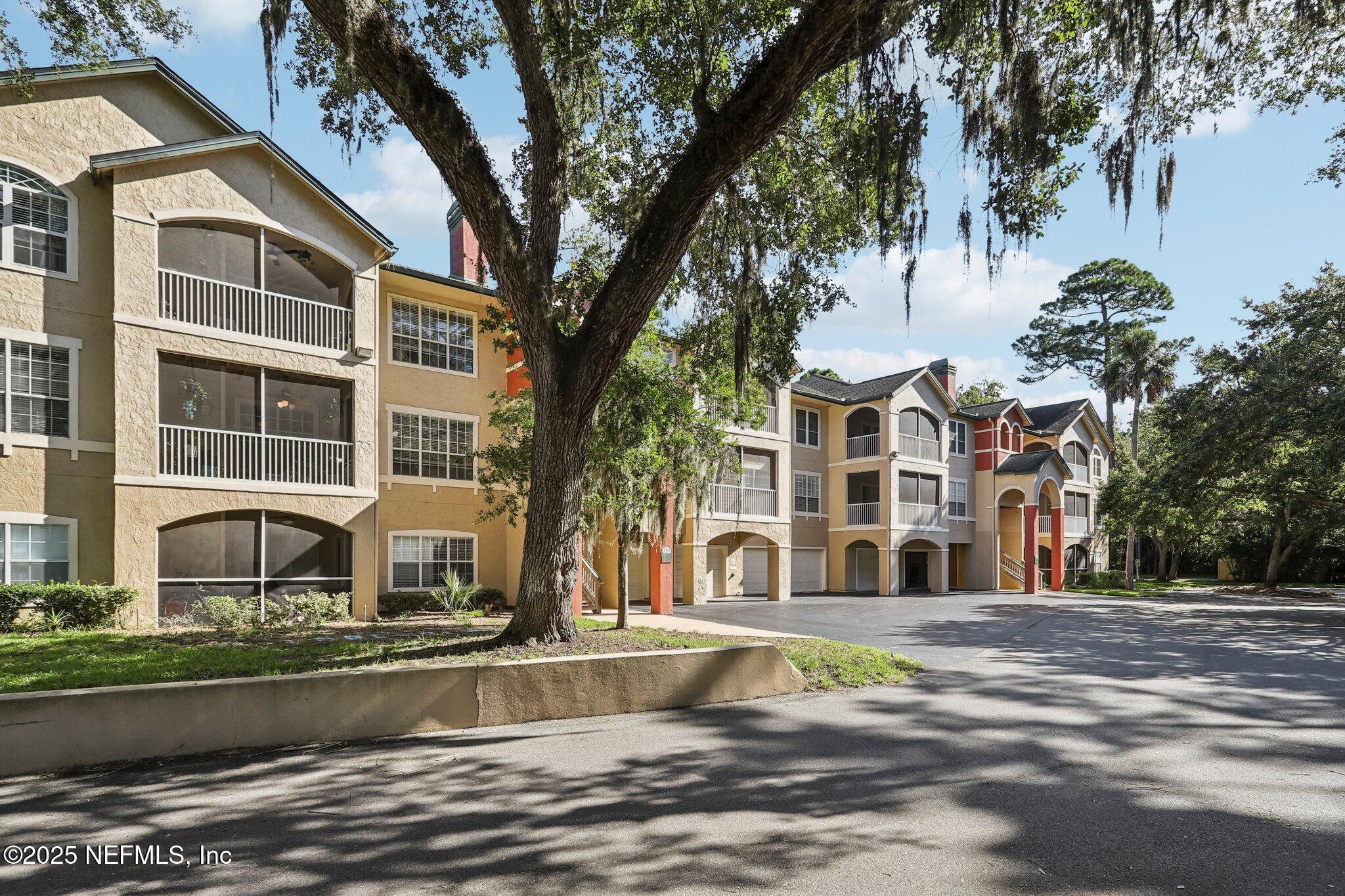 201 Colima Court, Unit 1221 Ponte Vedra Beach, FL 32082 - Photo 6 of 50 a building with trees in front of it