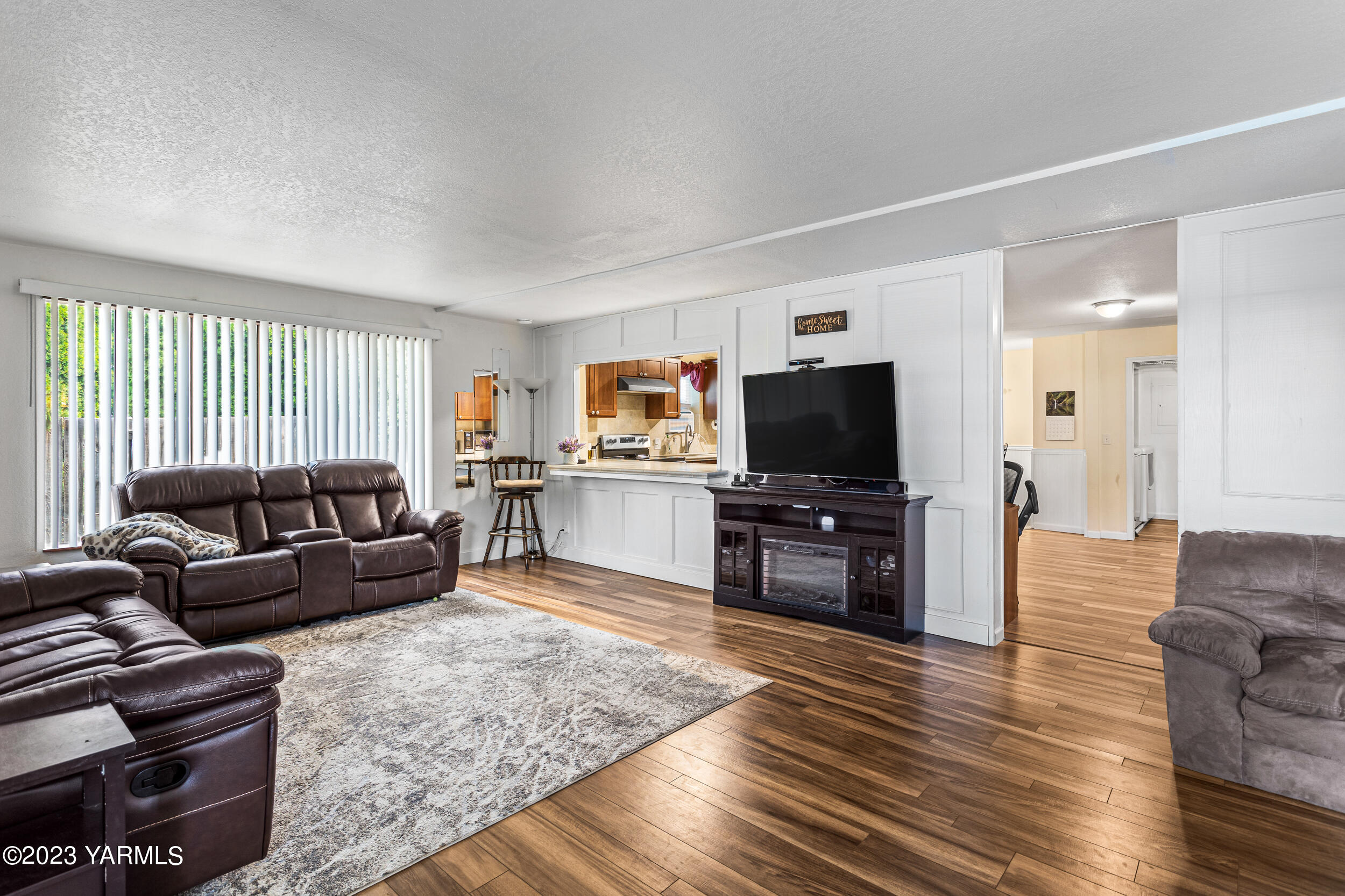 202 West Charron Road Moxee, WA 98936 - Photo 3 of 39 a living room with furniture and a flat screen tv
