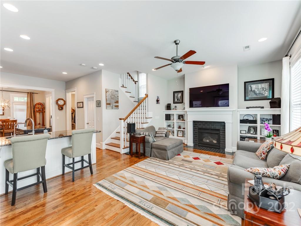 326 Mariemont Way Rock Hill, SC 29730 - Photo 13 of 36 a living room with furniture a fireplace and a flat screen tv