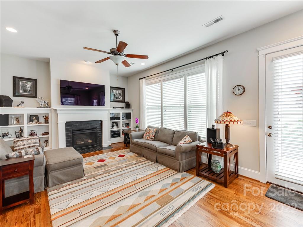 326 Mariemont Way Rock Hill, SC 29730 - Photo 15 of 36 a living room with furniture a fireplace and a flat screen tv