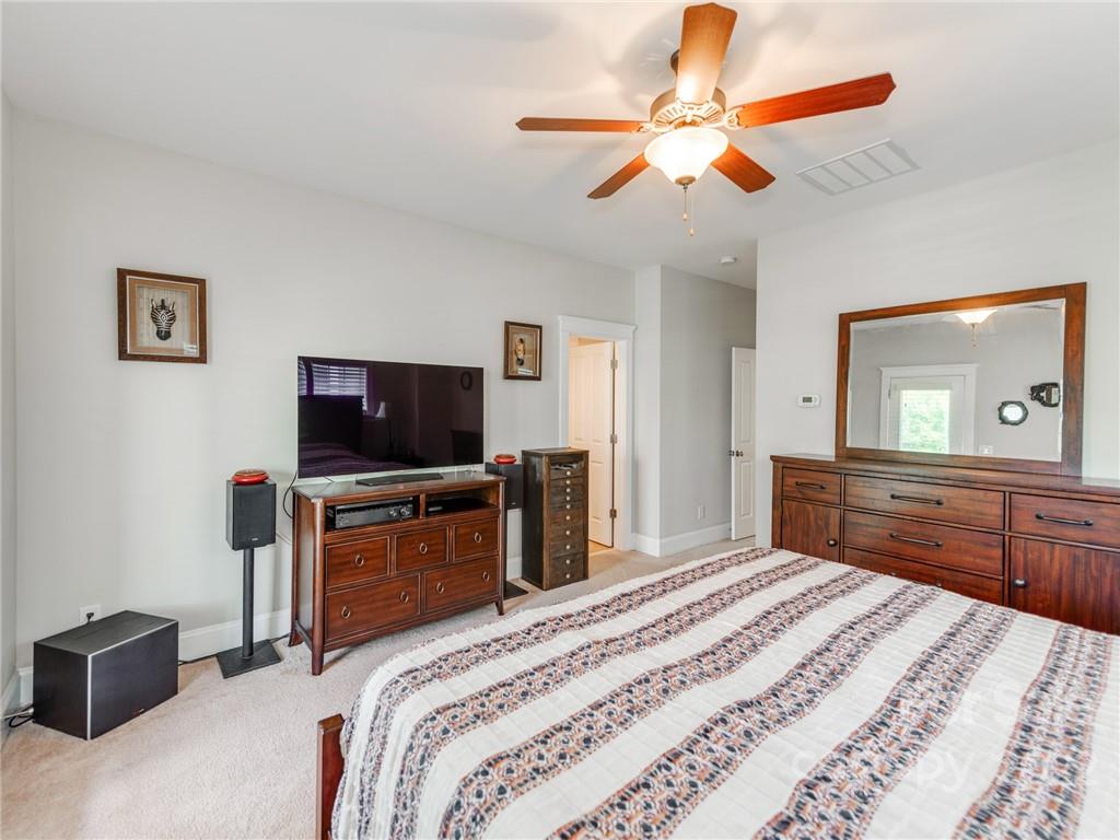 326 Mariemont Way Rock Hill, SC 29730 - Photo 20 of 36 a bedroom with a bed and a flat screen tv