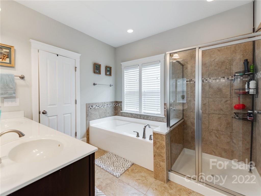 326 Mariemont Way Rock Hill, SC 29730 - Photo 22 of 36 a bathroom with a tub sink and shower