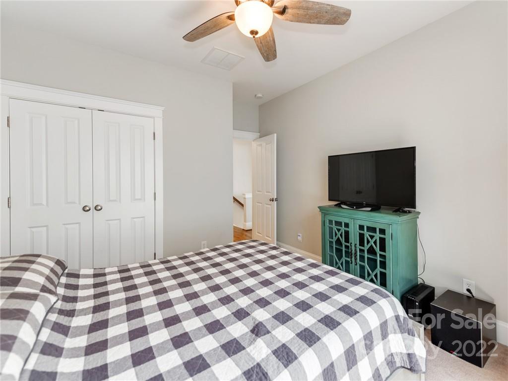 326 Mariemont Way Rock Hill, SC 29730 - Photo 26 of 36 a bedroom with a bed and a flat screen tv