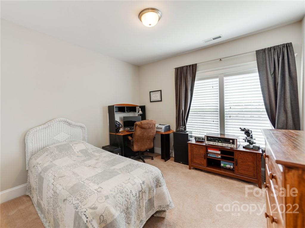 326 Mariemont Way Rock Hill, SC 29730 - Photo 28 of 36 a bedroom with a bed and a window