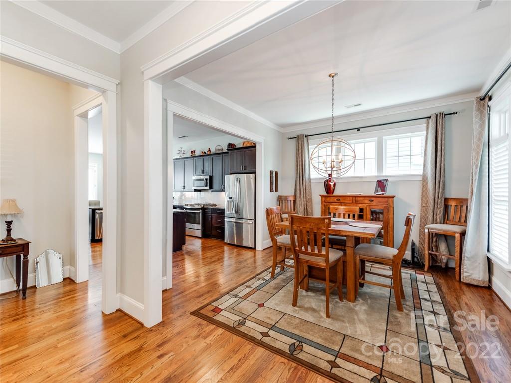 326 Mariemont Way Rock Hill, SC 29730 - Photo 5 of 36 a view of a dining room with furniture window and wooden floor