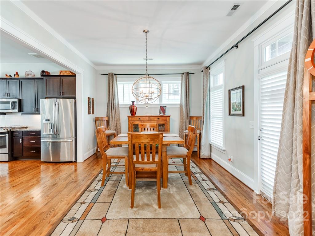 326 Mariemont Way Rock Hill, SC 29730 - Photo 6 of 36 a view of a dining room with furniture window and wooden floor